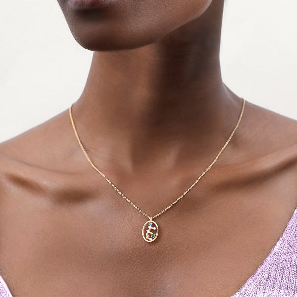 Woman wearing Virgo constellation necklace
