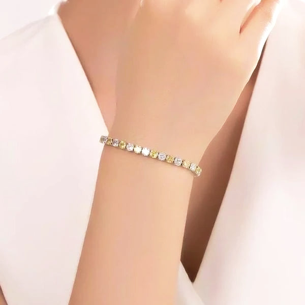 Yellow cubic zirconia tennis bracelet on a woman's wrist