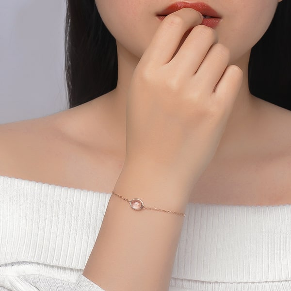 10K rose gold vermeil rose quartz bracelet on a woman's wrist