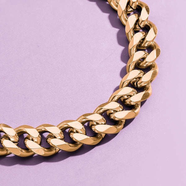 Close up image of a 3mm gold curb chain necklace