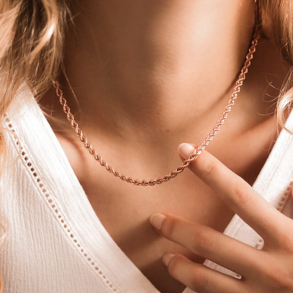 Woman wearing a 3mm rose gold rope chain necklace