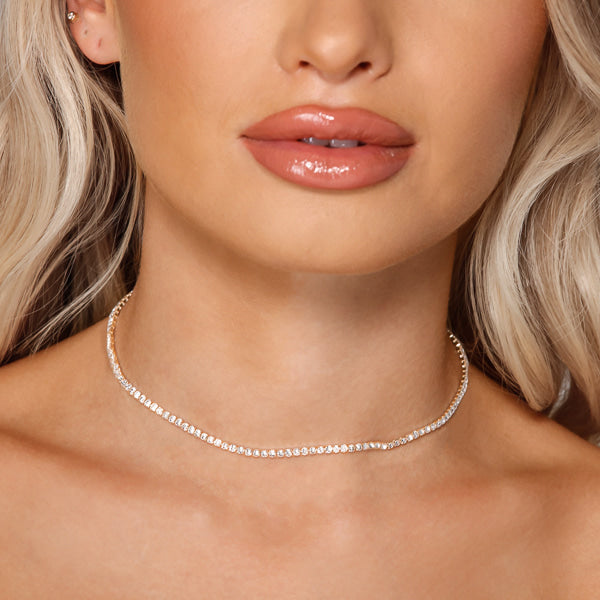 Woman wearing 3mm gold round tennis choker necklace
