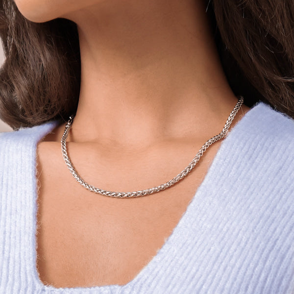 Woman wearing a 4mm silver wheat chain necklace