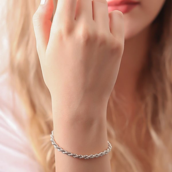 4mm silver rope chain bracelet displayed on a woman's wrist