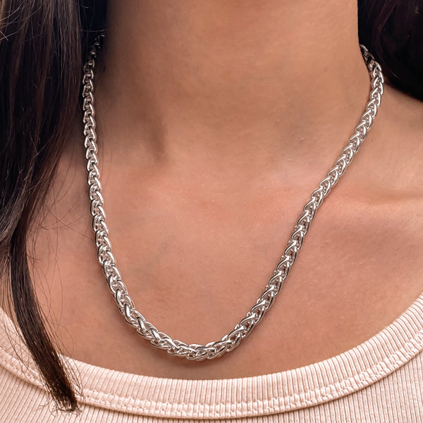 Woman wearing a 6mm silver wheat chain necklace