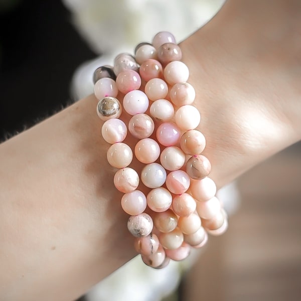 Beaded Pink Opal bracelet on a woman's wrist