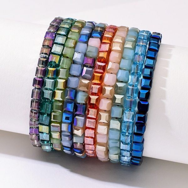 A stack of square crystal bead bracelets