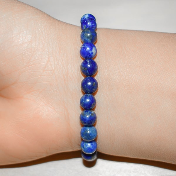 Beaded lapis lazuli bracelet on a woman's wrist
