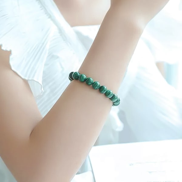 Beaded malachite bracelet on a woman's wrist