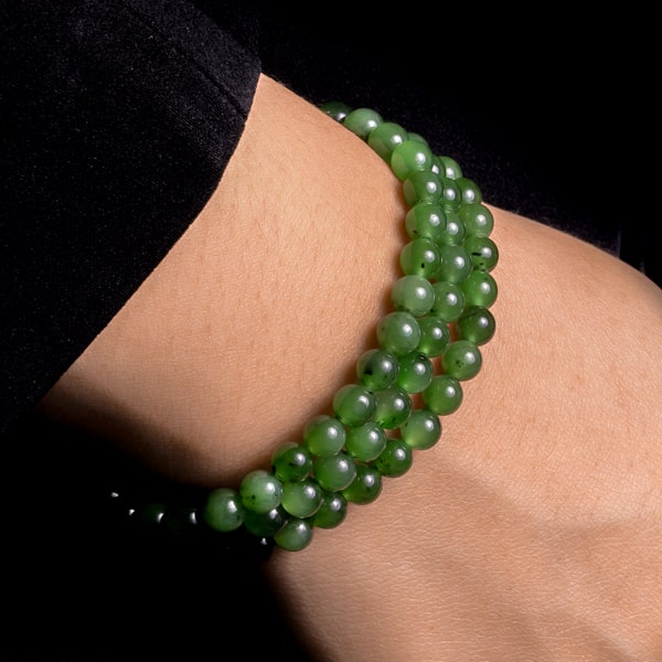 Beaded nephrite bracelet on a woman's wrist