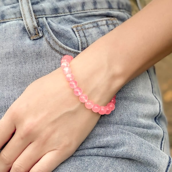 Beaded pink fluorite bracelet on a woman's wrist