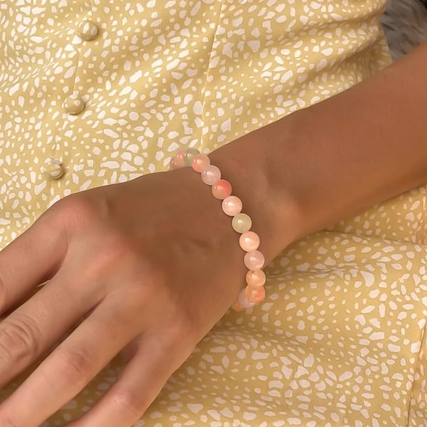 Beaded sunstone bracelet on a woman's wrist