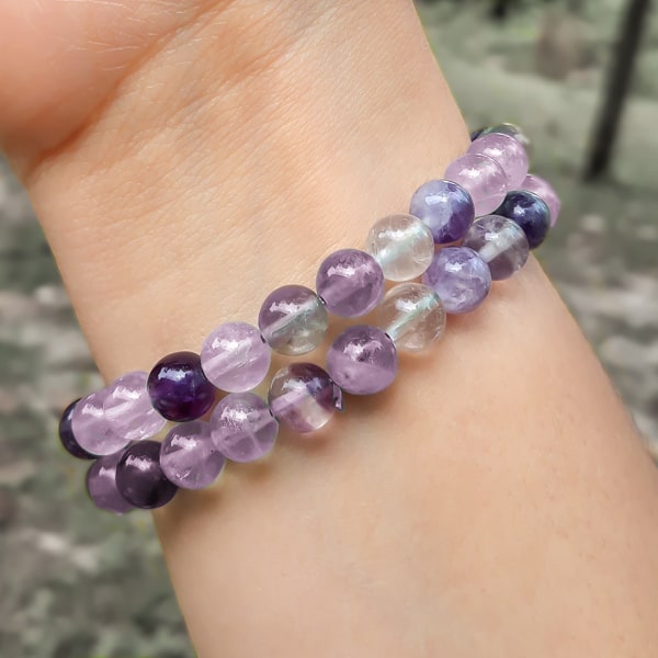 Beaded violet fluorite bracelet on a woman's wrist