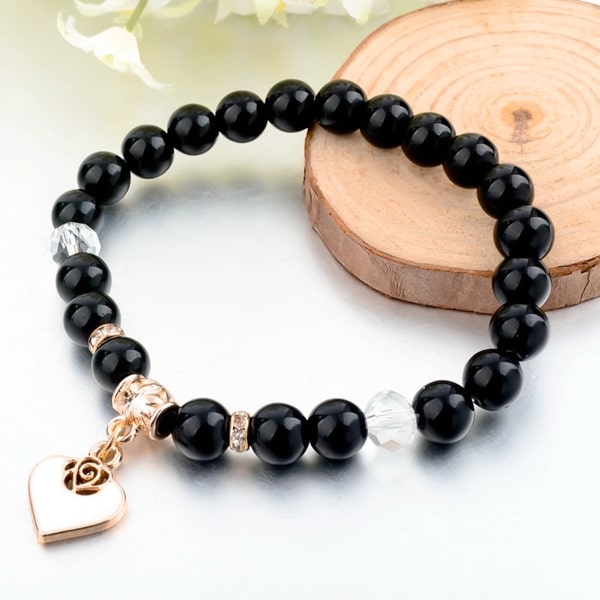 Black natural stone bracelet with gold heart charm