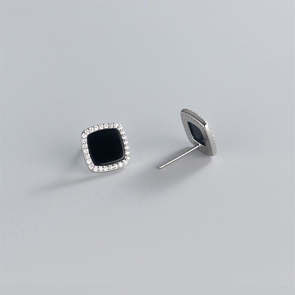 Black square cubic zirconia halo stud earrings made of sterling silver