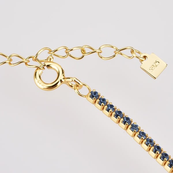 Details of the gold tennis choker necklace with blue cubic zirconia stones