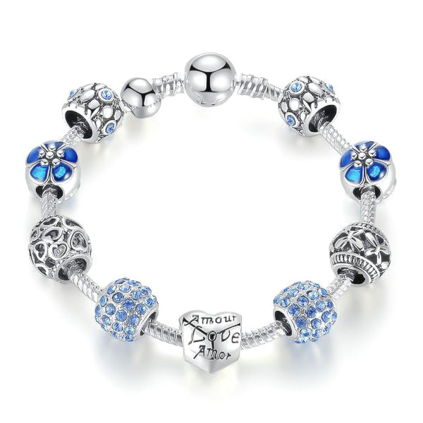 Blue love charm bracelet with heart, flower, butterfly charms and blue cubic zirconia