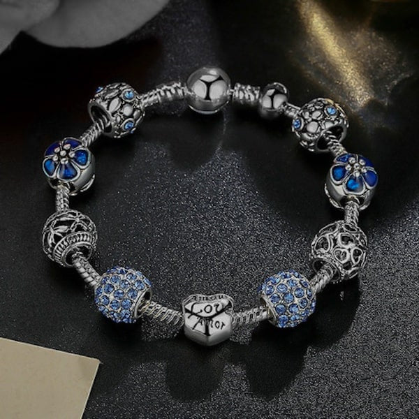 Blue charm bracelet with snake chain