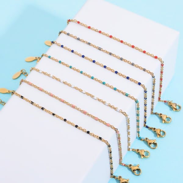 Thin gold chain bracelet with blue beads