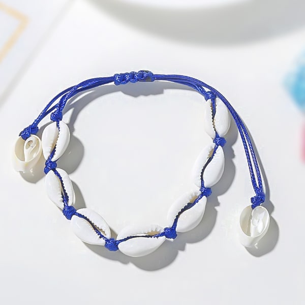 Blue cowrie shell ankle bracelet detailed close up
