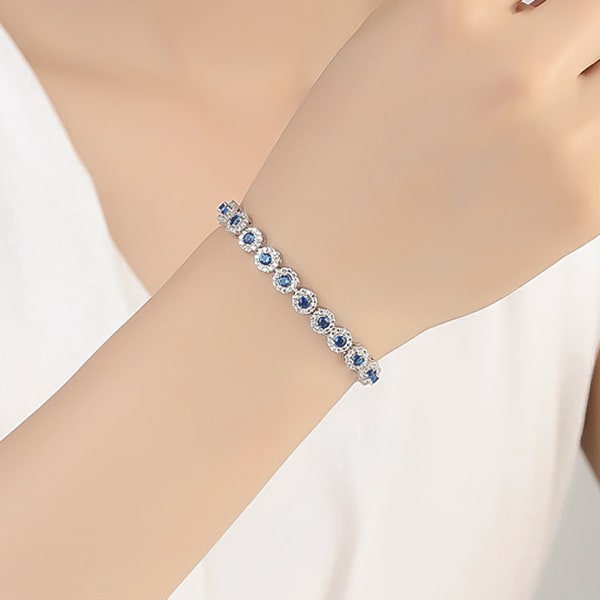 Blue halo crystal bracelet on a woman's wrist