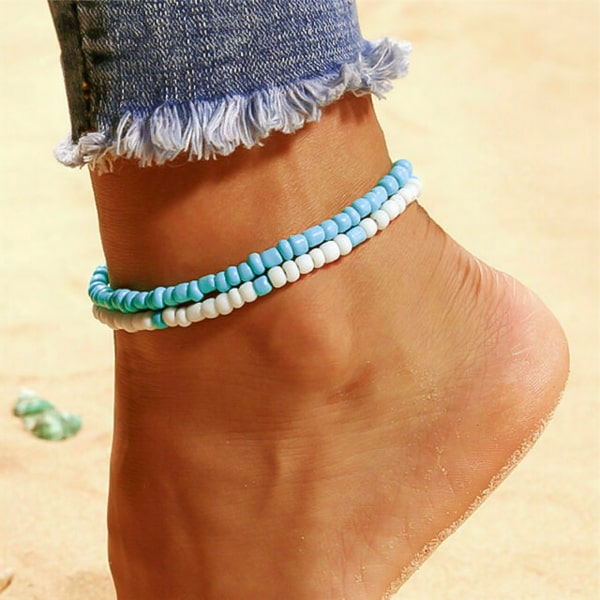 Blue handmade beaded anklet on womans ankle