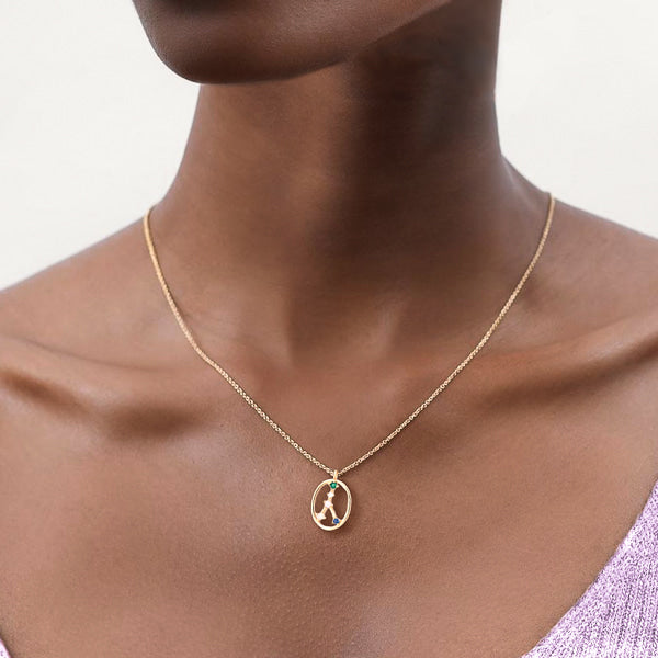 Woman wearing Cancer constellation necklace