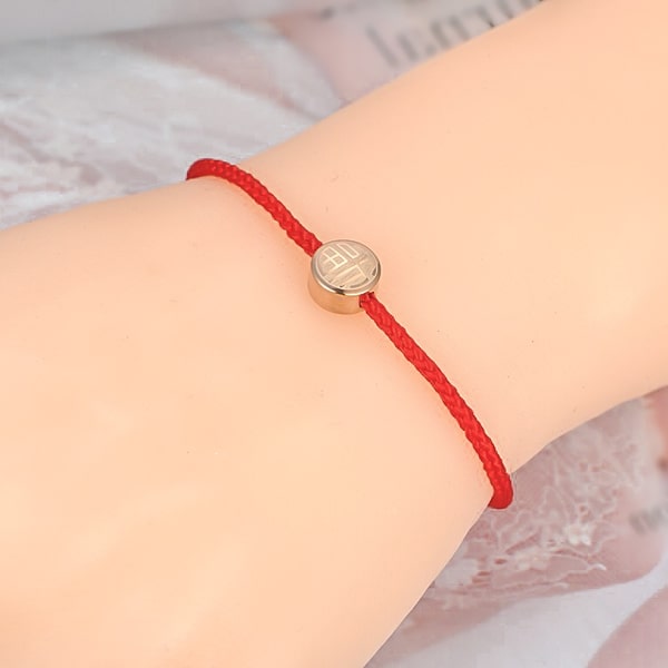 Chic red rope bracelet on woman's wrist