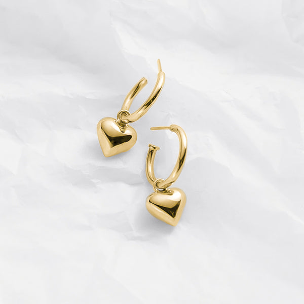 Chunky gold dangle heart hoop earrings details