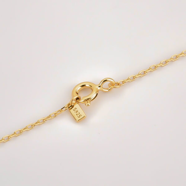 The clasp of the dainty gold vermeil initial necklace