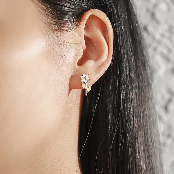 Woman wearing crystal flower earrings