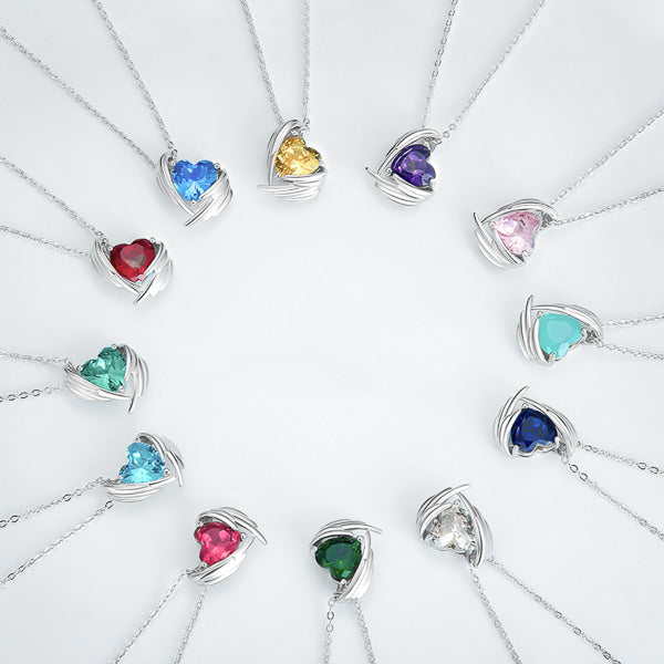 All twelve crystal heart birthstone necklaces displayed next to each other