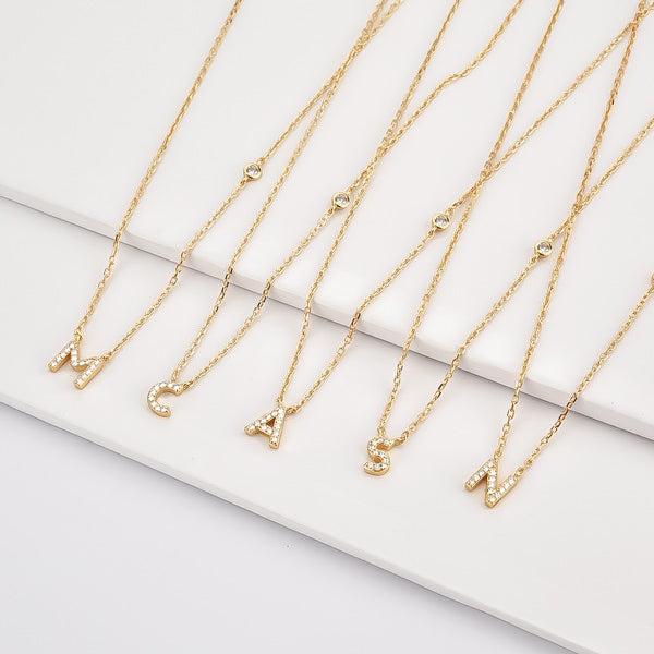 Dainty initial necklace made of gold vermeil and sparkling cubic zirconia