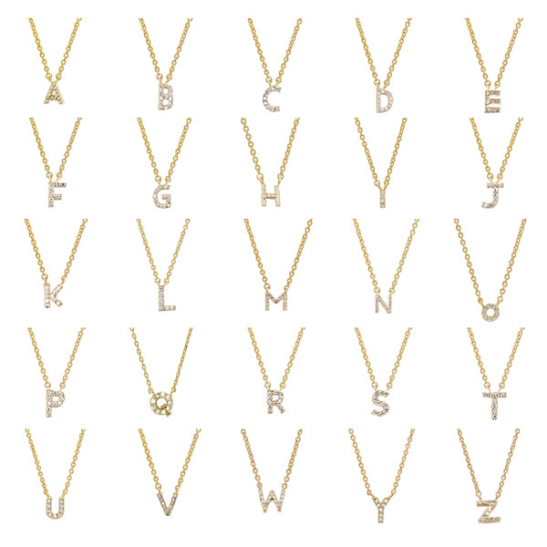 Mini initial letter charms on a dainty gold necklace