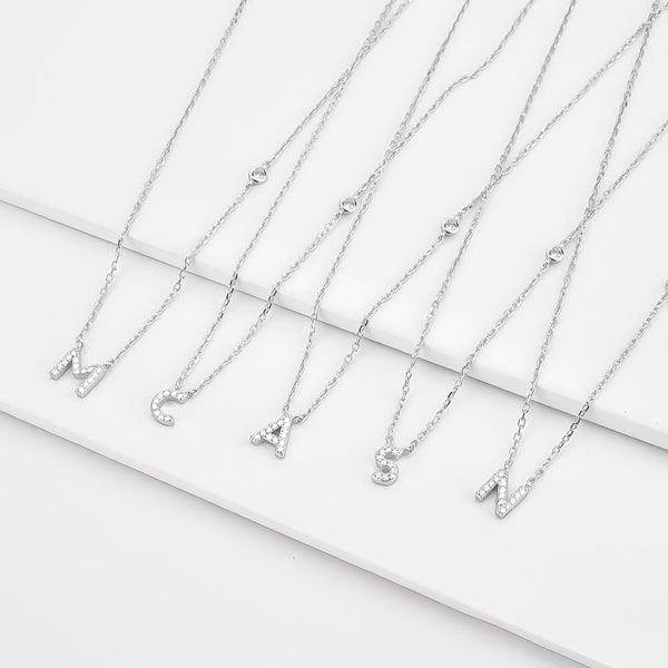 Dainty initial necklace made of sterling silver and sparkling cubic zirconia