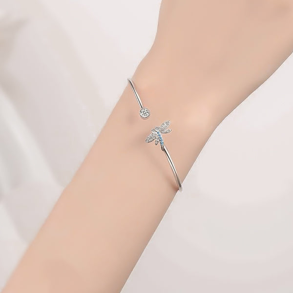 Woman wearing a dragonfly cuff bracelet on her wrist