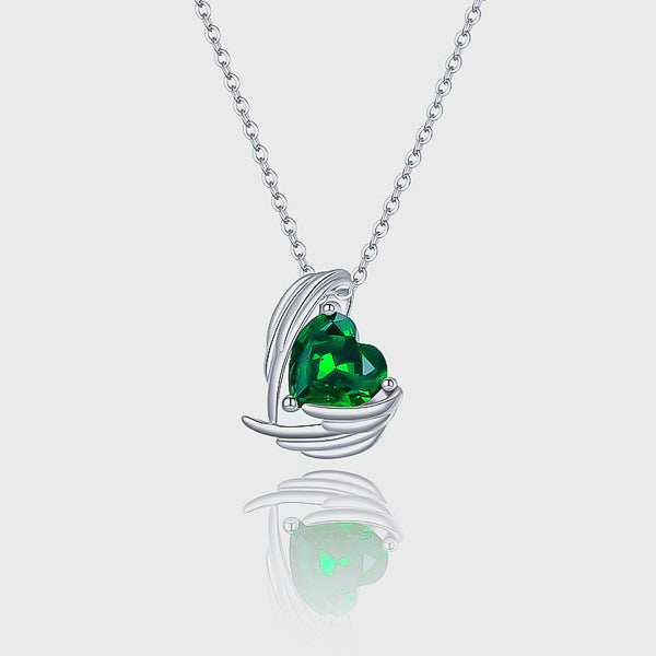 Emerald green crystal heart and angel wings pendant on a silver chain details