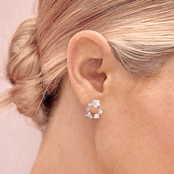 Woman wearing silver and pink feminine essence earrings