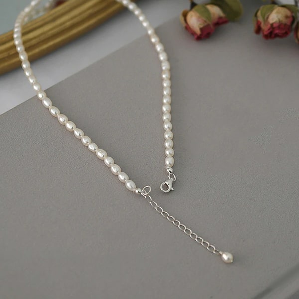 3-4mm oval pearl choker necklace with a flower ornament silver lock display