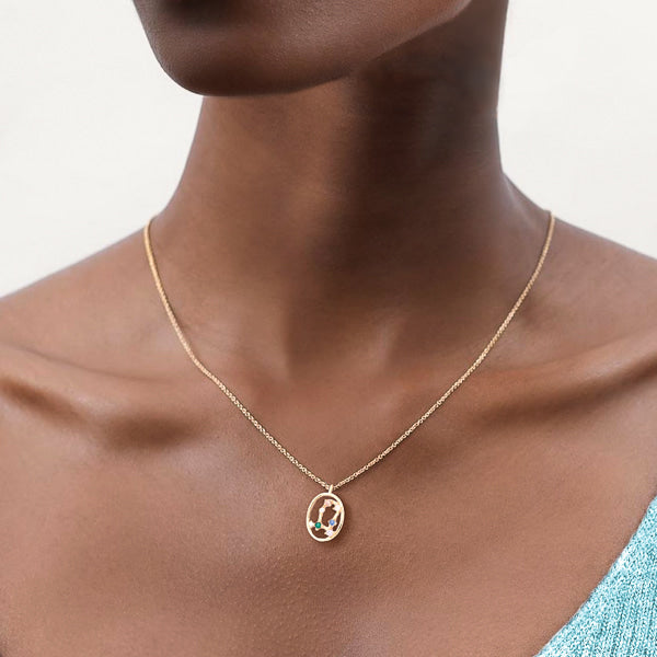 Woman wearing Gemini constellation necklace