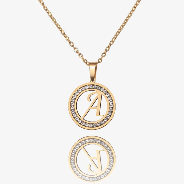 Round gold letter coin necklace with crystal halo