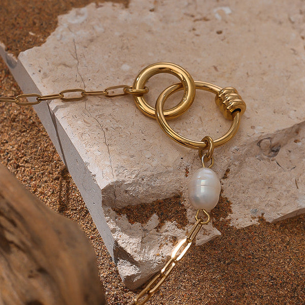 Gold rings pendant and white pearl on gold paperclip chain