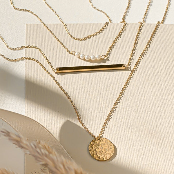 A set of gold layered necklaces