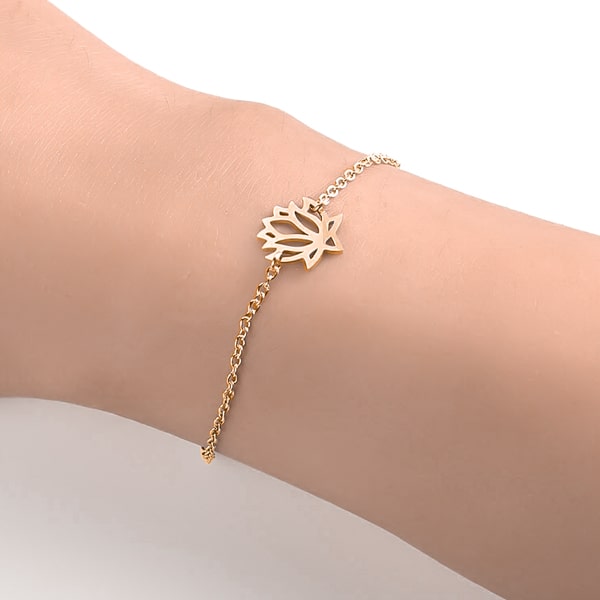 Woman wearing a gold lotus flower bracelet