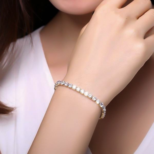 Gold cubic zirconia tennis bracelet on a woman's wrist