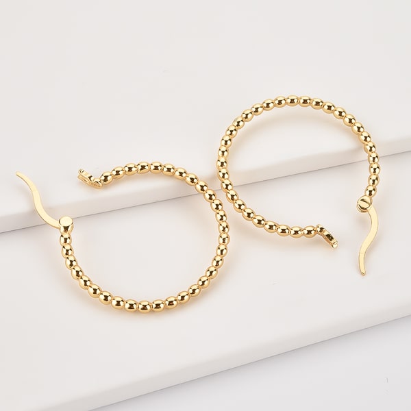 Gold beaded hoop earrings details