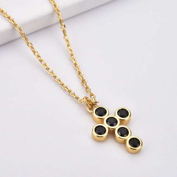 Gold rounded cross necklace with black crystals details