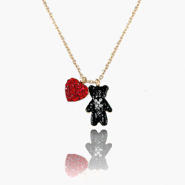 Red crystal heart and black crystal teddy bear pendant on a gold necklace details
