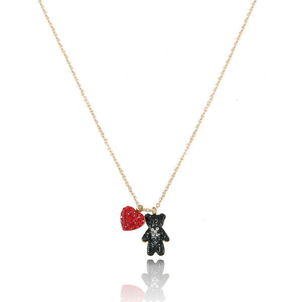 Red crystal heart and black crystal teddy bear pendant on a gold necklace
