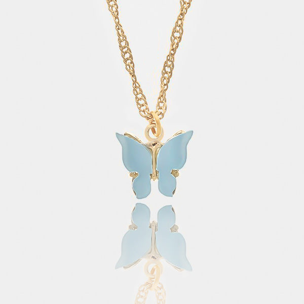 Blue butterfly pendant on a gold necklace details